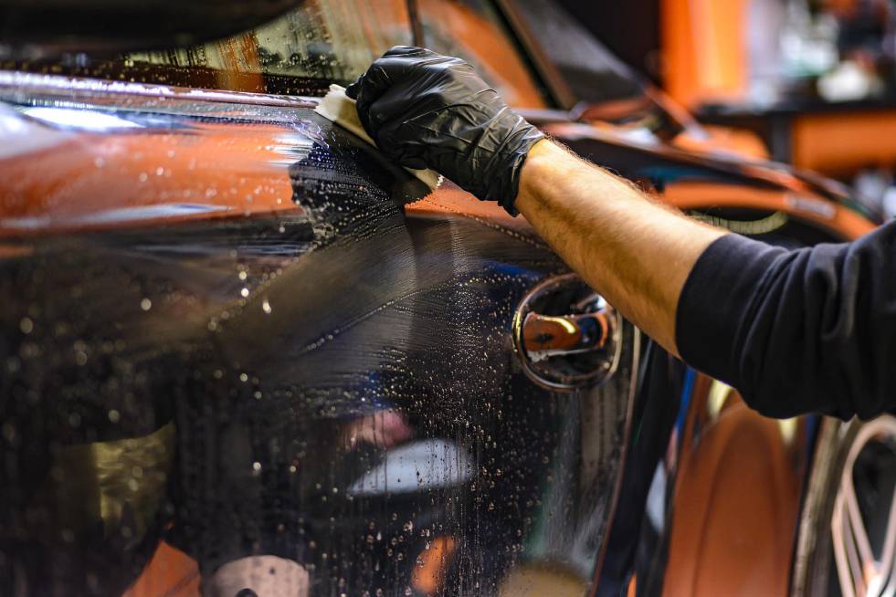 man cleaning the car